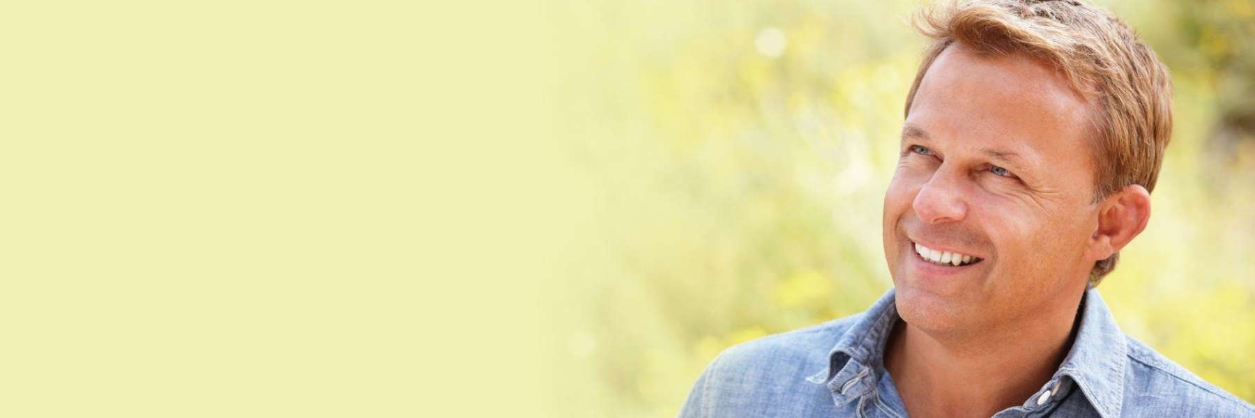 man with blonde hair smiling